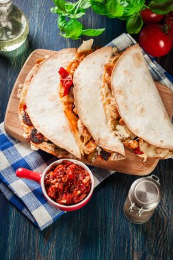 Mexican Quesadilla with chicken, sausage chorizo and red pepper clipart
