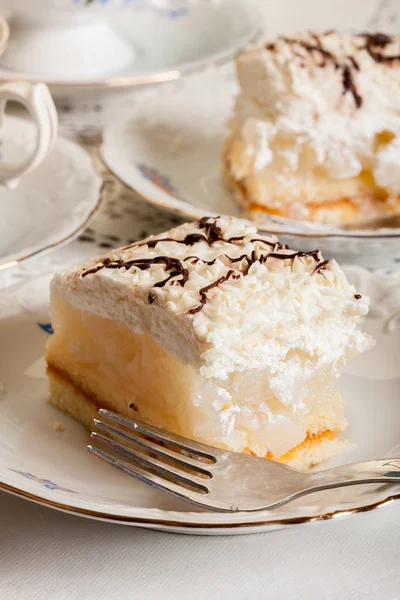 Fresh sweet apple cake with whipped cream served with cup of tea — Stock Photo, Image