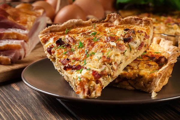 Pieces of quiche lorraine with bacon and cheese — Stock Photo, Image