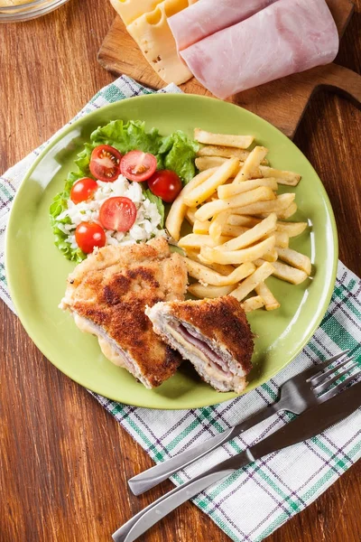 Cutlet Cordon Bleu with pork loin served with French fries and s — Stock Photo, Image