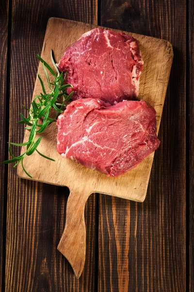 Fresh raw beef steak sirloin with rosemary