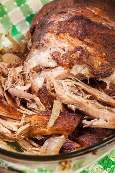 Slow cooked pulled pork shoulder with onion and garlic