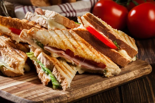 Stack of panini with ham, cheese and lettuce sandwich — Stock Photo, Image