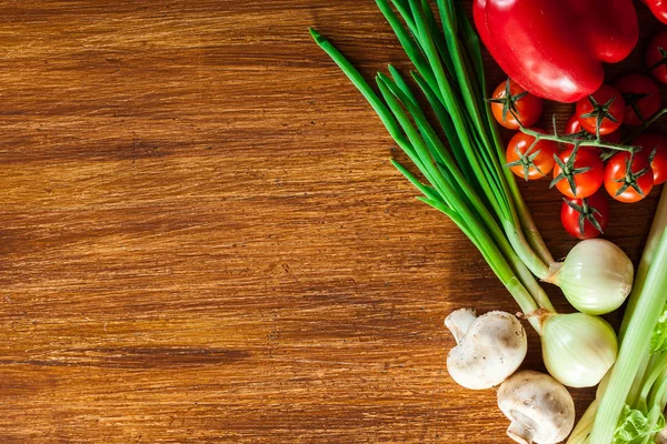 Fresh vegetable borders on wooden background — Stock Photo, Image