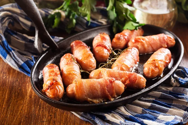 Pigs in blankets in baking dish — Stock Photo, Image