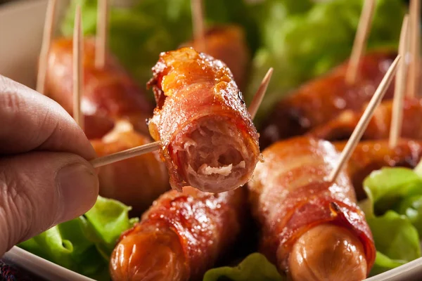 Pigs in blankets on a plate — Stock Photo, Image