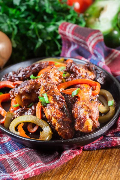 Chinese chicken wings with vegetables in sweet and sour sauce — Stock Photo, Image