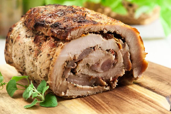 Roasted pork roll stuffed with other meat and dried tomatoes — Stock Photo, Image