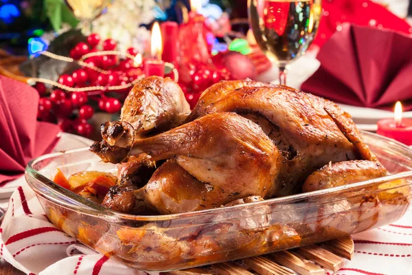 Baked or roasted whole chicken on Christmas table — Stock Photo, Image