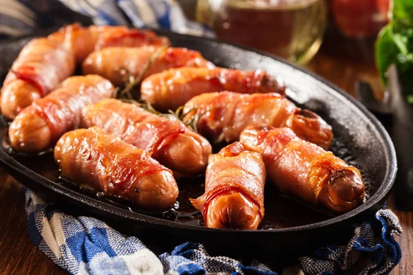 Pigs in blankets in baking dish — Stock Photo, Image