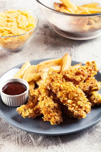 Chicken strips in cornflakes breadcrumb — Stock Photo, Image