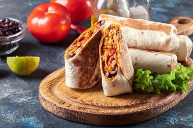 Burritos wraps with mincemeat, beans and vegetables clipart