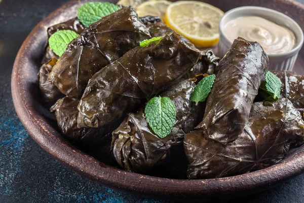 Dolma - stuffed grape leaves with rice and meat — Stock Photo, Image