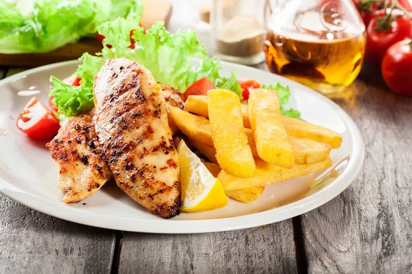Grilled Chicken Breasts Served Fries Fresh Salad Plate — Stock Photo, Image