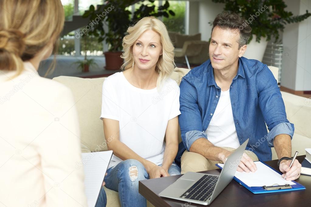 couple  consulting with l financial advisor