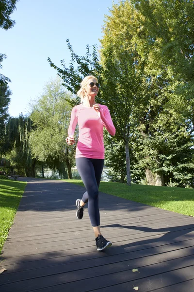 Beautiful young woman running — Stock Photo, Image