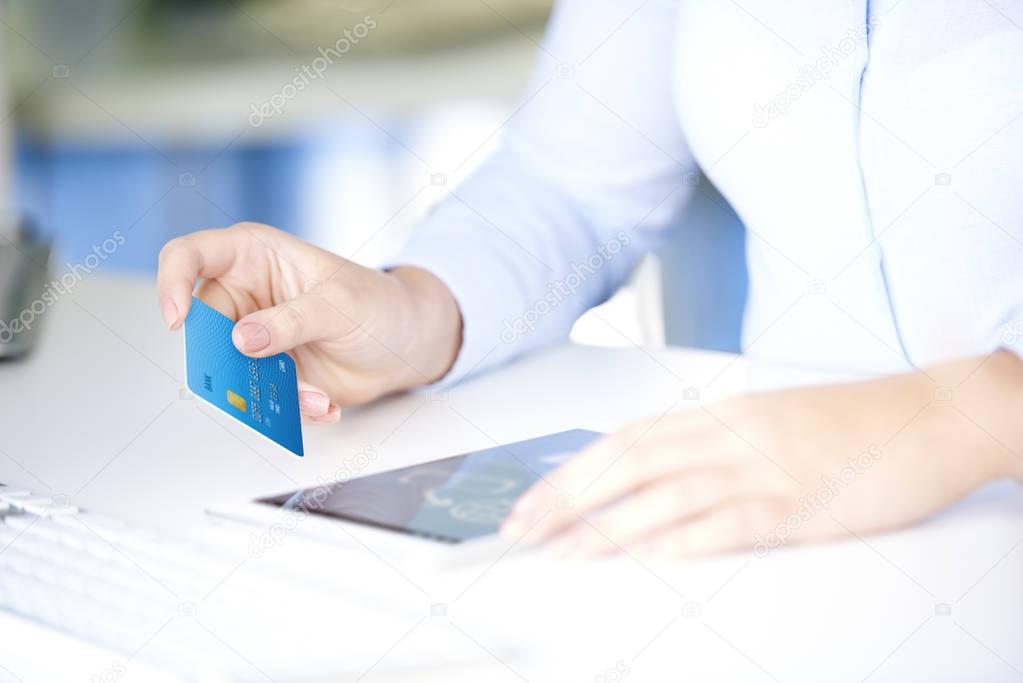 businesswoman holding credit card 