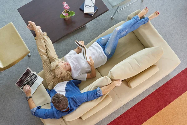 couple relaxing on the sofa