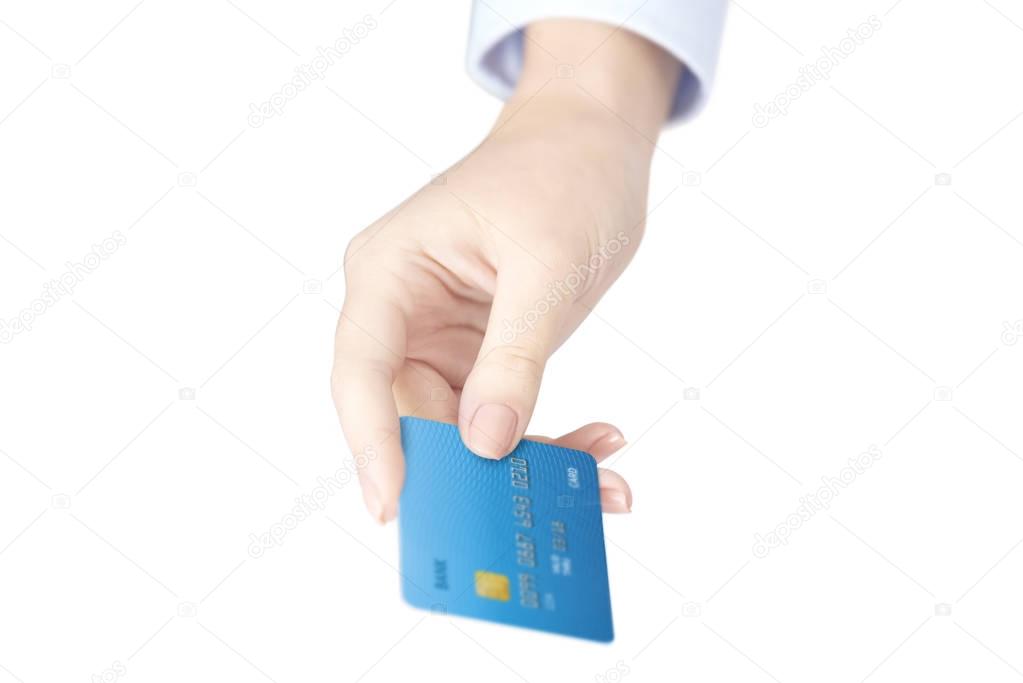 Close-up shot of a female's hand holding credit card at isolated white background.