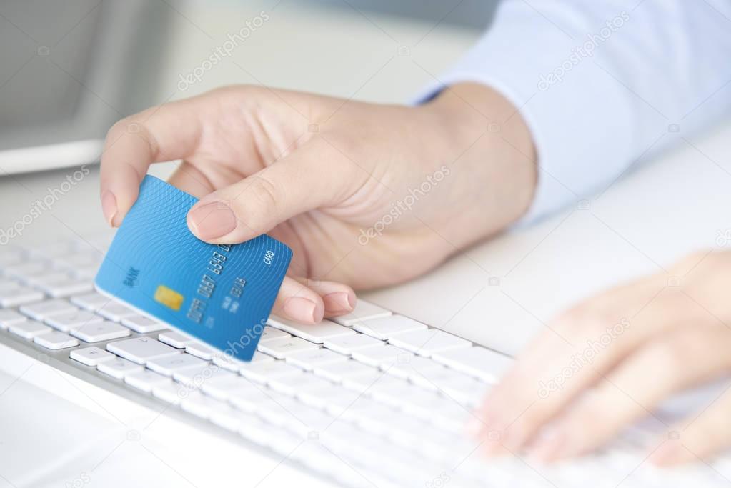 businesswoman  holding credit card 