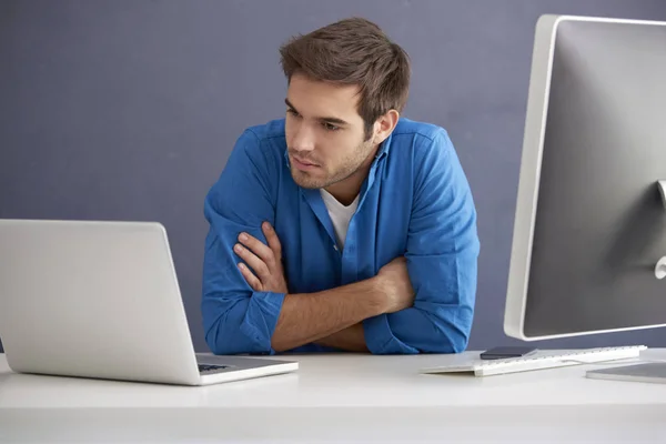 Professional man sitting at desk — Stock Photo, Image