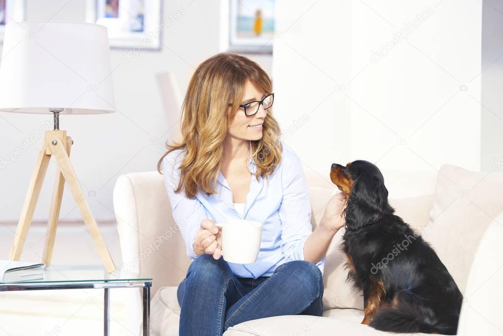 woman enjoying time with her pet dog