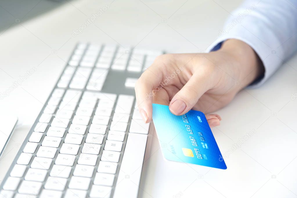  woman holding bank card