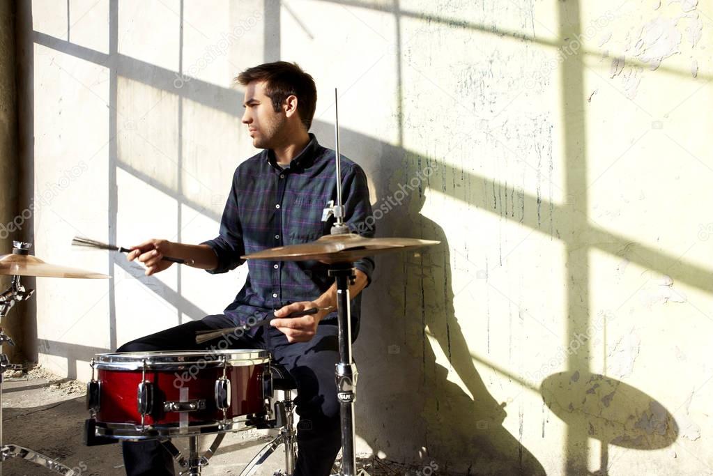 musician playing on drums 