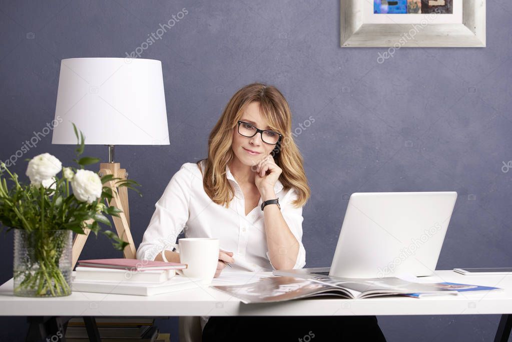 woman sitting in front of laptop 