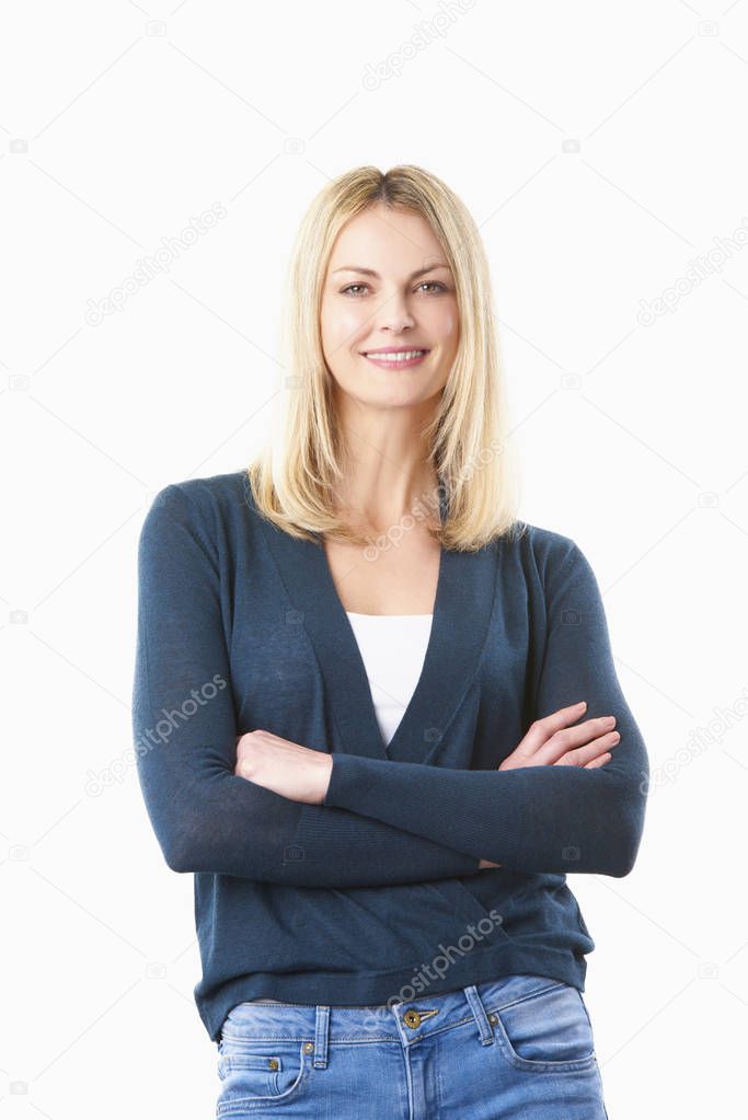 woman with  arms folded standing 
