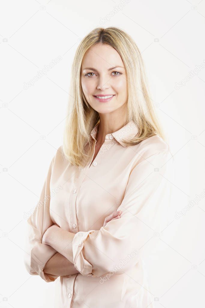 woman with  arms folded standing 