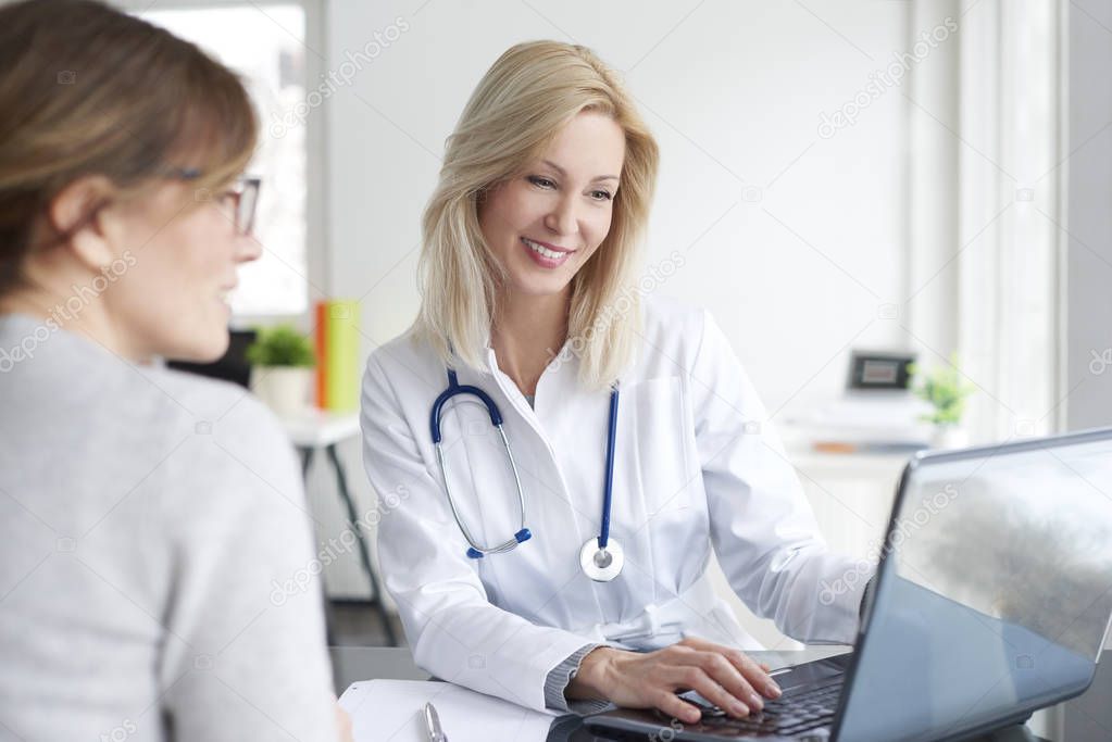  doctor sitting in front of laptop