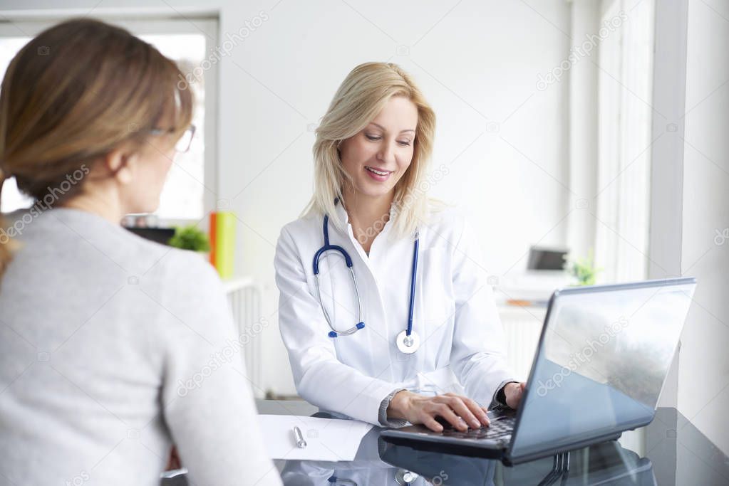  doctor sitting in front of laptop