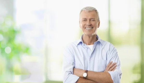 Businessman standing in the office — Stock Photo, Image