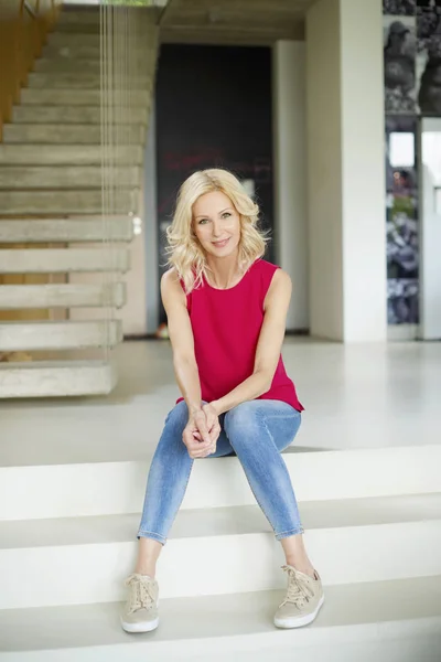 woman  sitting on steps