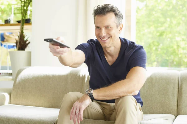 Man holding remote controll — Stock Photo, Image