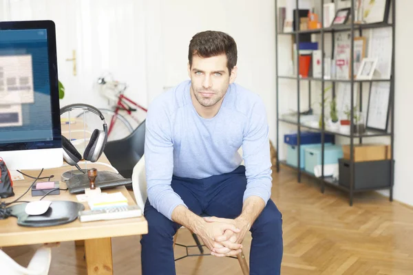 Creative designer sitting at desk — Stock Photo, Image