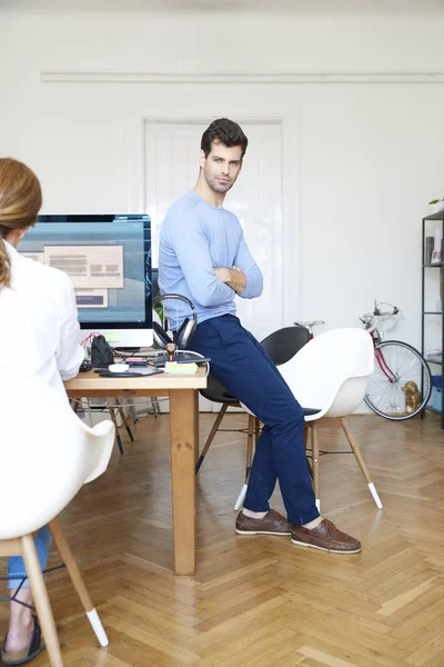 Creative director sitting at desk — Stock Photo, Image