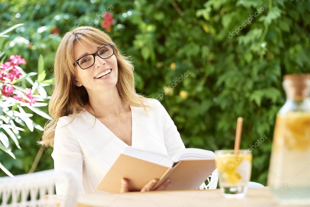  woman relaxing  with a good book. 