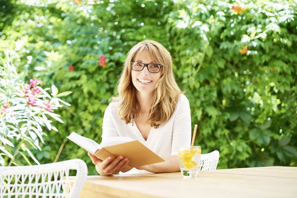 Attractive middle aged woman relaxing — Stock Photo, Image