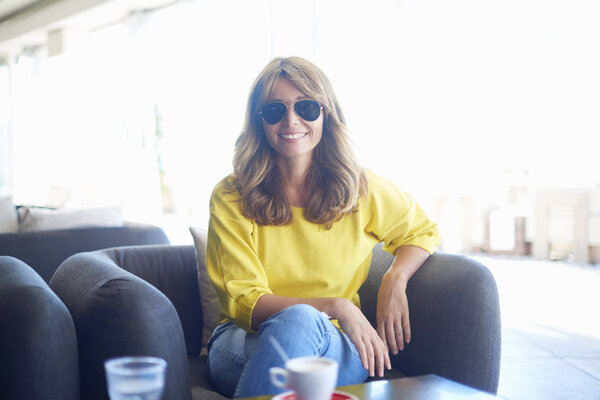 woman relaxing and enjoying  coffee