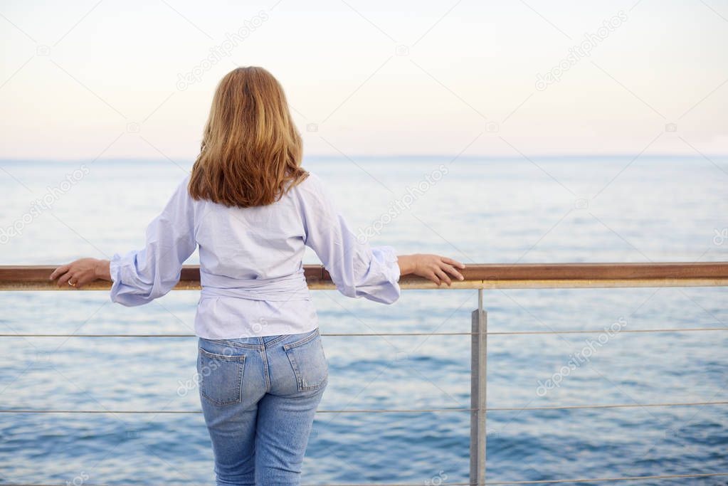 woman standing at balcony