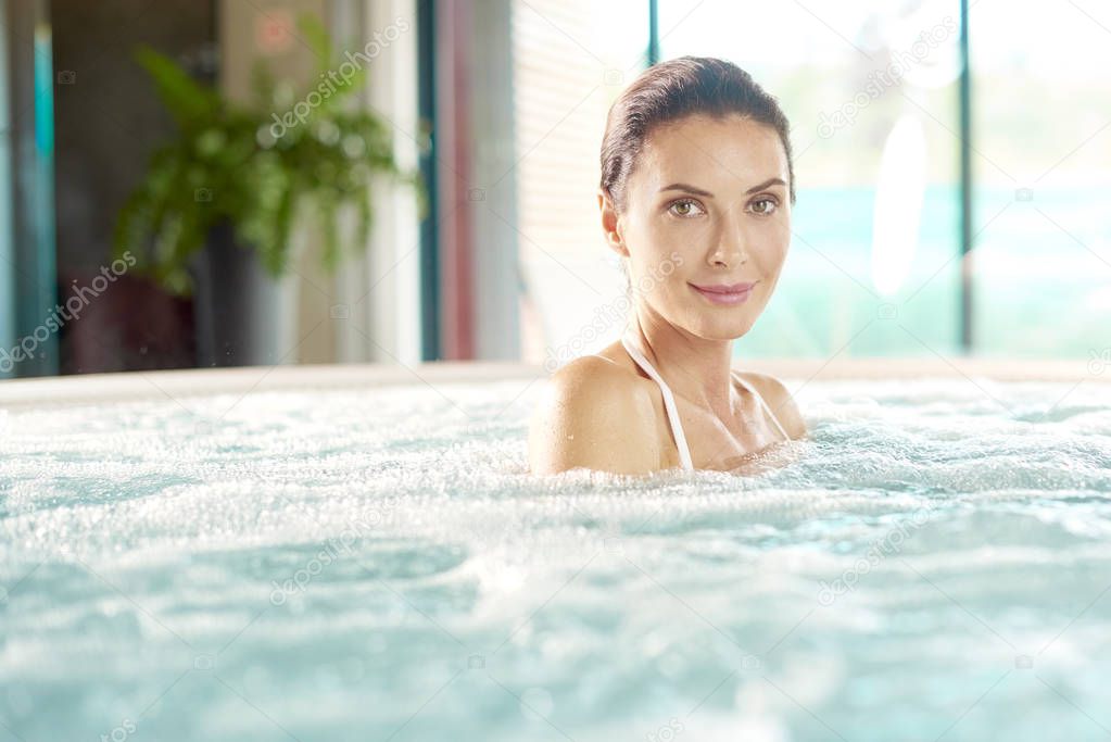  woman relaxing in jacuzzi 