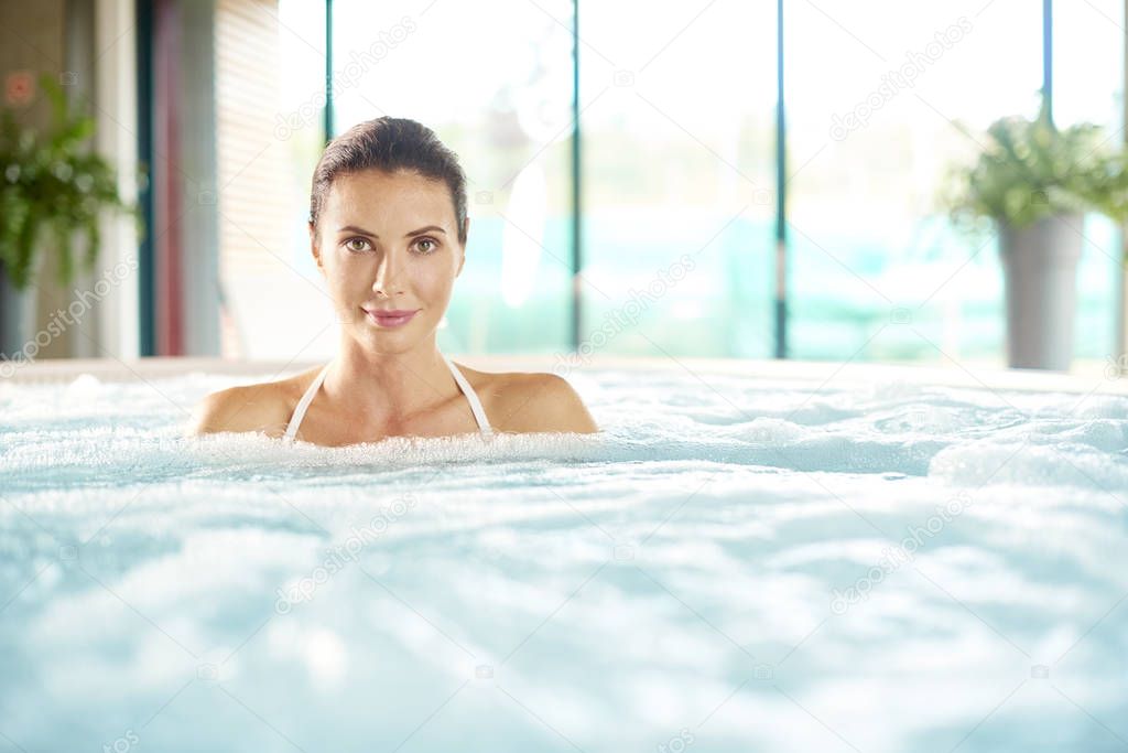  woman relaxing at  spa.