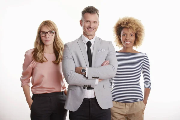 Businessman standing with his colleagues — Stock Photo, Image