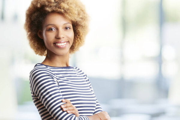 businesswoman standing with arms crossed