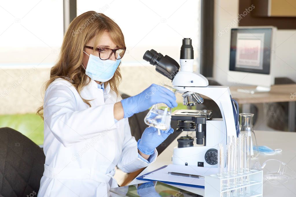  assistant preparing for medical lab test 