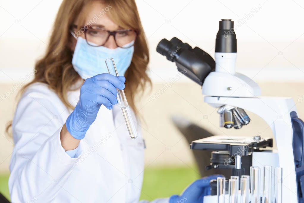 assistant preparing for medical lab test 