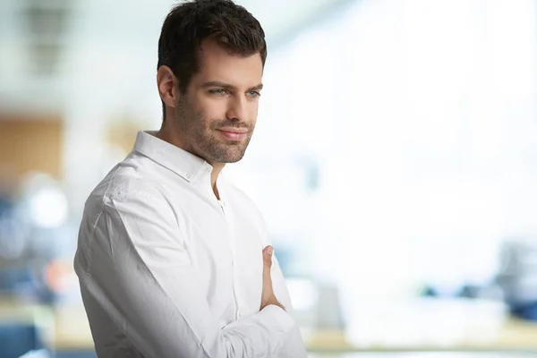 Confident Smiling Young Businessman Standing Arms Crossed Office — Stock Photo, Image