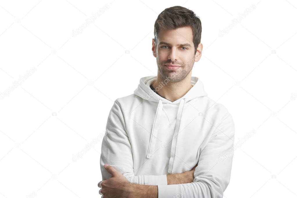  man with folded arms wearing hoodie 